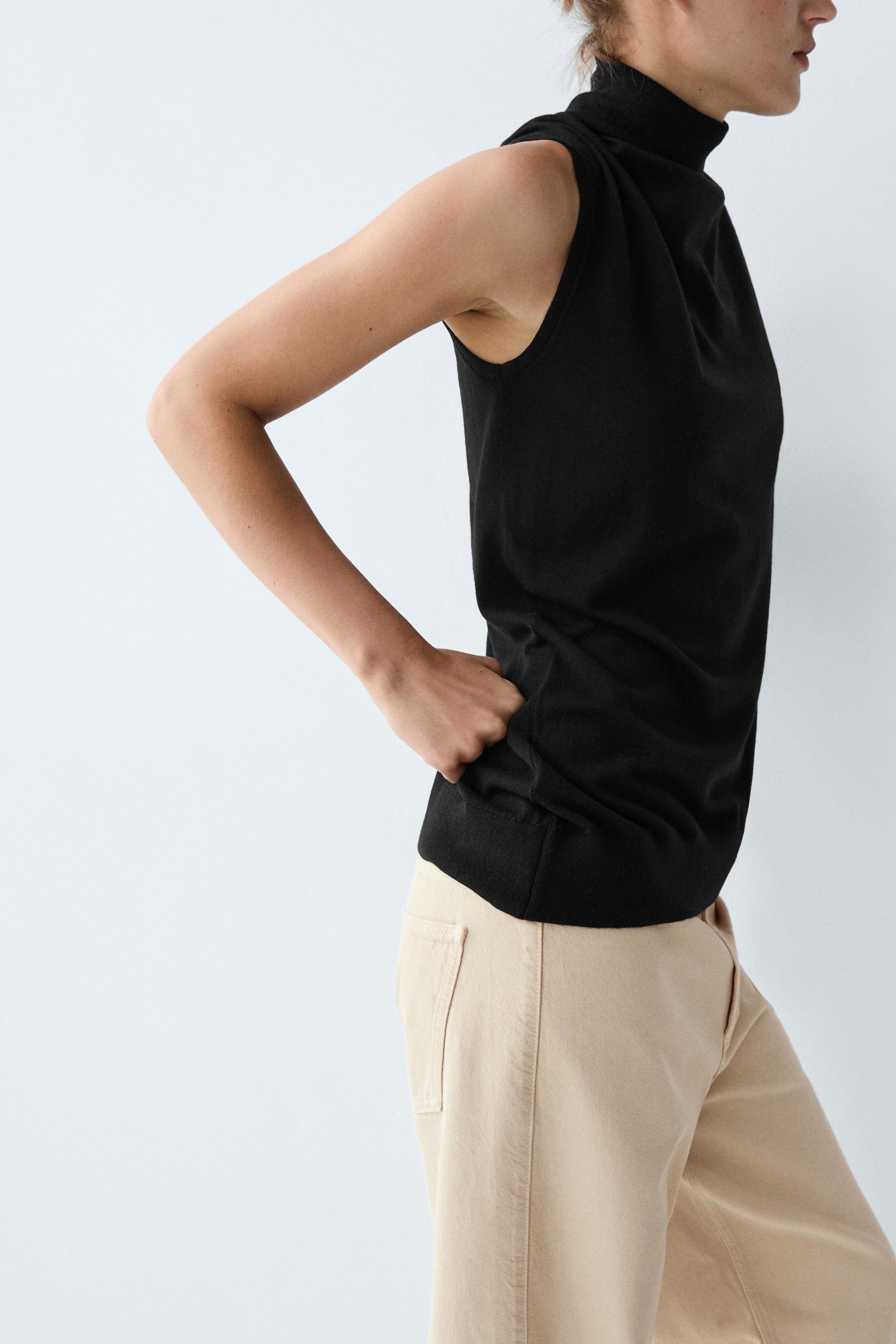 Asymmetric hem turtleneck top